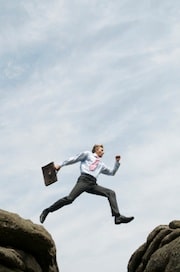 doctor leaping over boulders