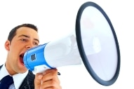 man yelling into megaphone