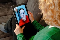 woman video chatting on smart pad device