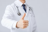 Doctor holding thumbs up