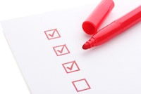 checklist written in red ink