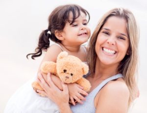 daughter and mother smiling