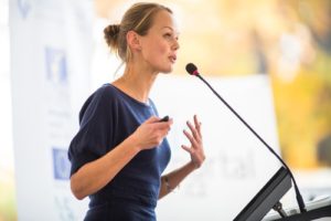 woman giving inspirational speech