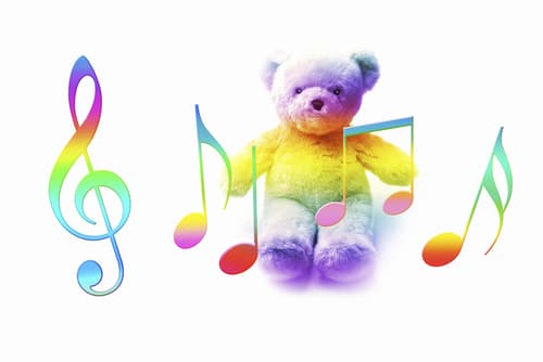 Colorful music notes in front of a teddy bear