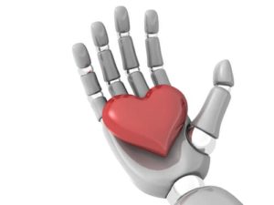 robotic hand holding metal heart