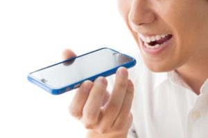 Woman talking on a cellphone on speaker