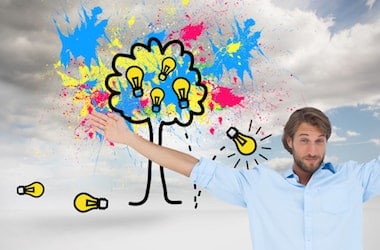 Man with his arms up thinking up ideas with cloudy sky background