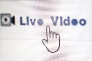 mouse on computer pointing to live facebook video