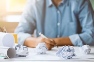 crumpled papers while brainstorming healthcare content